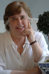 Jane Yolen sitting at a table