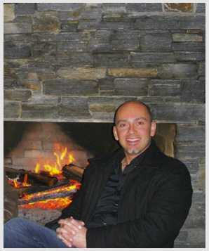 A person sitting in front of a fireplace