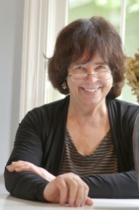 Jane Yolen sitting at a table