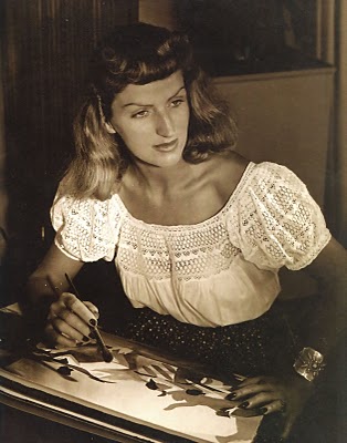 Mary Blair sitting at a table