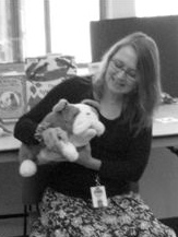 A woman holding a stuffed animal
