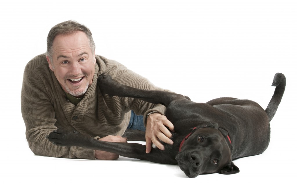 A man holding a dog