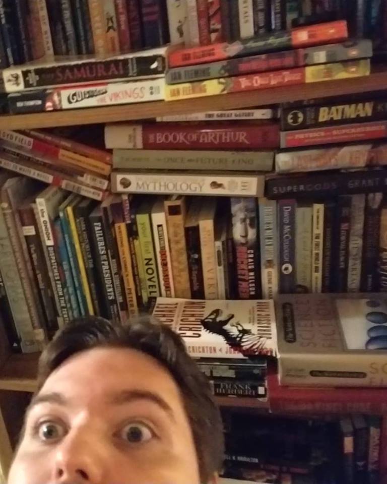 A person in front of a book shelf