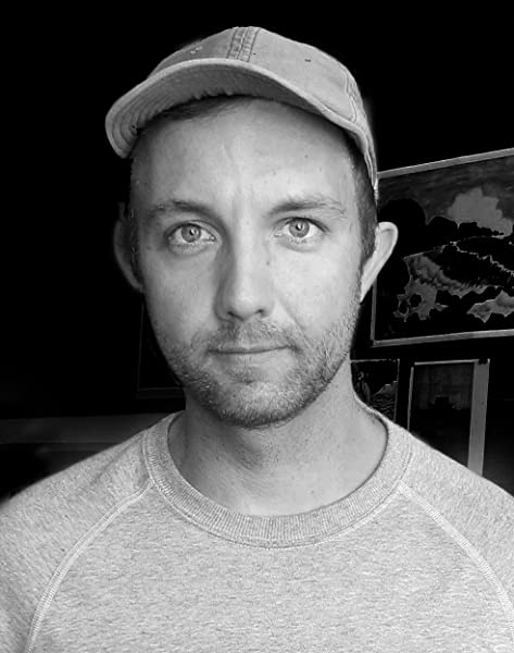 Jon Klassen: Author Headshot. Black and white. Wearing a hat.