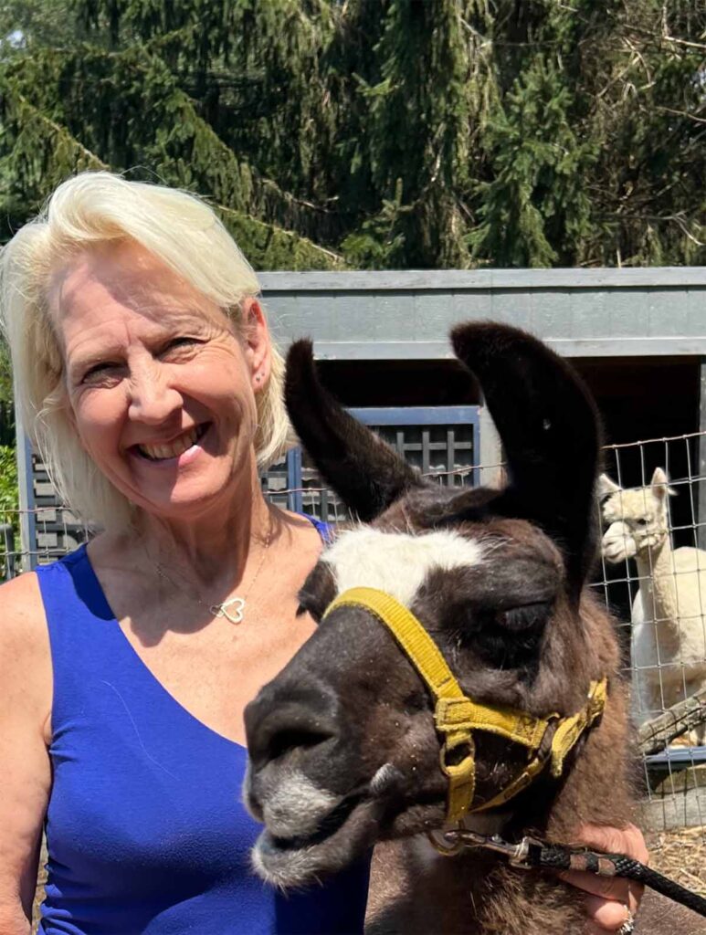 Sue Nichols: Author Headshot with Llamas
