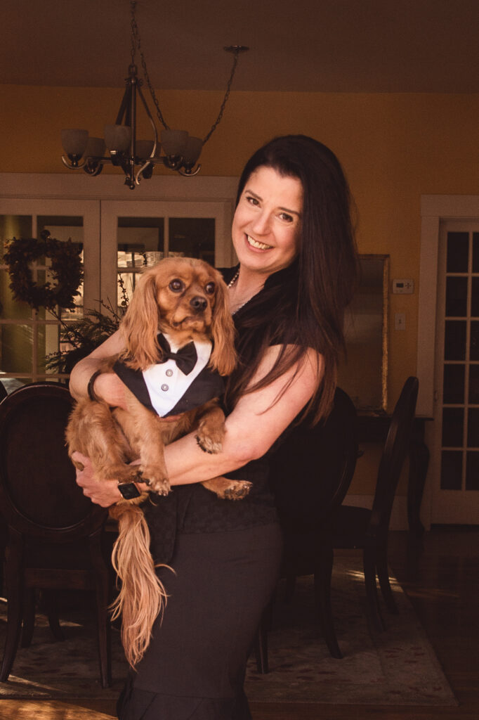 Talar Herculian Coursey: Author Headshot holding her dog.