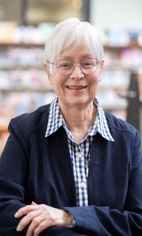 Author headshot of Ann Cavera